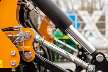Close-up of technical units and mechanisms of agricultural machinery. Structural elements for tillage and harvesting