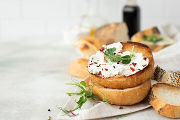 toasted buns with curd cheese and fresh herbs