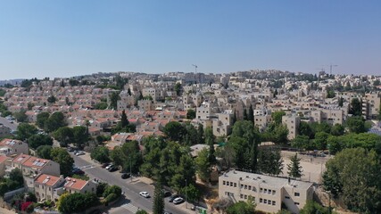 Fototapeta na wymiar North Jerusalem Ramot neighbourhood with red rooftops, aerial view jewish orthodox neighbourhood, July,2020 