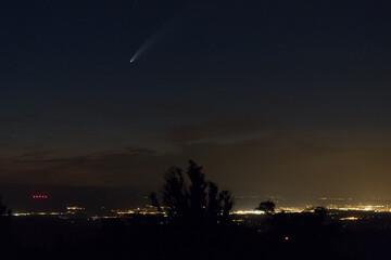 View of the comet Neowise above the town of Montélimar, France