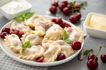 dumplings with fresh cherry and sour cream
