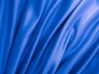 Beautiful elegant wavy classic blue satin silk luxury cloth fabric texture, abstract background design.