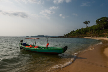 Naklejka na ściany i meble Vietnamese traditional boat at the beach in sunset. Phu Quoc island,. Vietnam