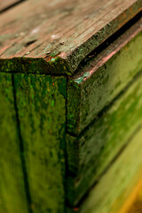 wooden boards with peeling paint, aged ragged background for design. drawer angle view