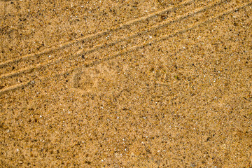 Top view. Background with copy space and visible sand texture.