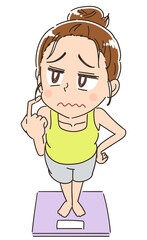 部屋着を着た女性と体重計