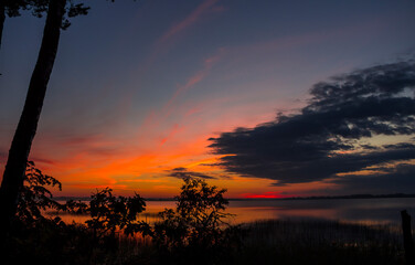 Summer lake at dawn, nature background.