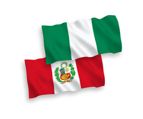 Obraz premium National vector fabric wave flags of Peru and Nigeria isolated on white background. 1 to 2 proportion.