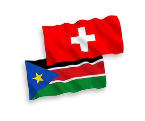 National vector fabric wave flags of Republic of South Sudan and Switzerland isolated on white background. 1 to 2 proportion.