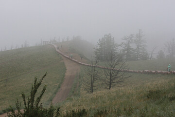  Fogs on Olkhon Island. Natural background, mountain landscape. Morning foggy forest