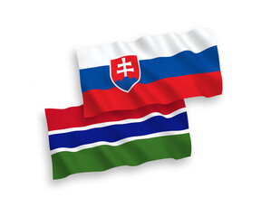 National vector fabric wave flags of Slovakia and Republic of Gambia isolated on white background. 1 to 2 proportion.