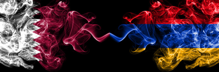 Qatar vs Armenia, Armenian smoky mystic flags placed side by side. Thick colored silky abstract smoke flags. © Vlad