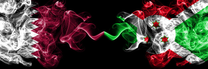 Qatar vs Burundi, Burundian smoky mystic flags placed side by side. Thick colored silky abstract smoke flags.