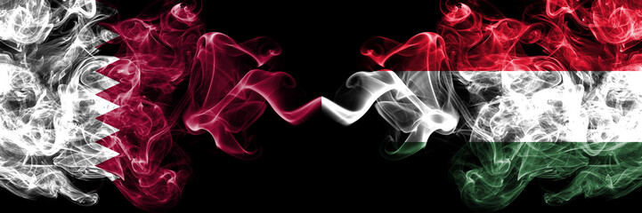 Qatar vs Hungary, Hungarian smoky mystic flags placed side by side. Thick colored silky abstract smoke flags.