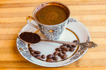 coffee Cup with coffee beans on a saucer