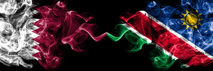Qatar vs Namibia, Namibian smoky mystic flags placed side by side. Thick colored silky abstract smoke flags.