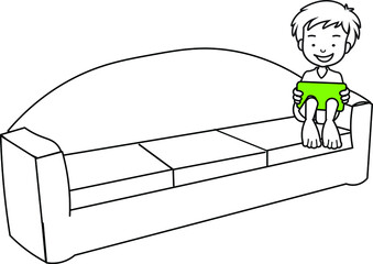 boy kid playing on tablet sitting on a sofa