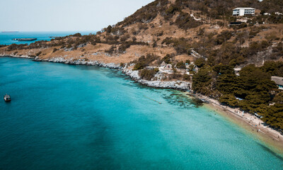 Costline of such a beautiful turquoise and crystal clear beach at Koh Sichang, an island close to Bangkok, Thailand

