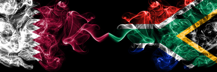 Qatar vs South Africa, African smoky mystic flags placed side by side. Thick colored silky abstract smoke flags.
