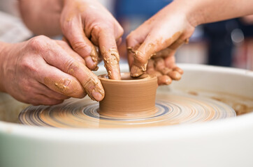 hands of a potter at work