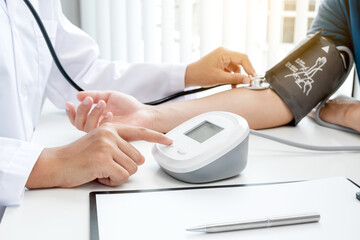 The doctor measured blood pressure, the patient examined the heartbeat and talked about health care closely