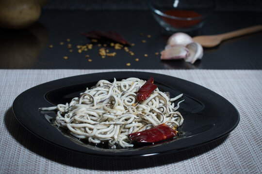 plate of eels with garlic and chilli