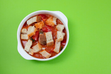 cold tomato soup gaspacho with bread in white bowl