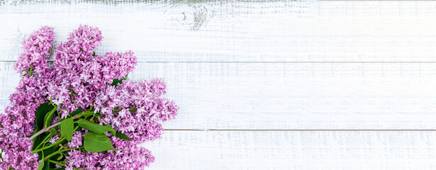 bouquet of lilacs on a light wooden background. copy space .