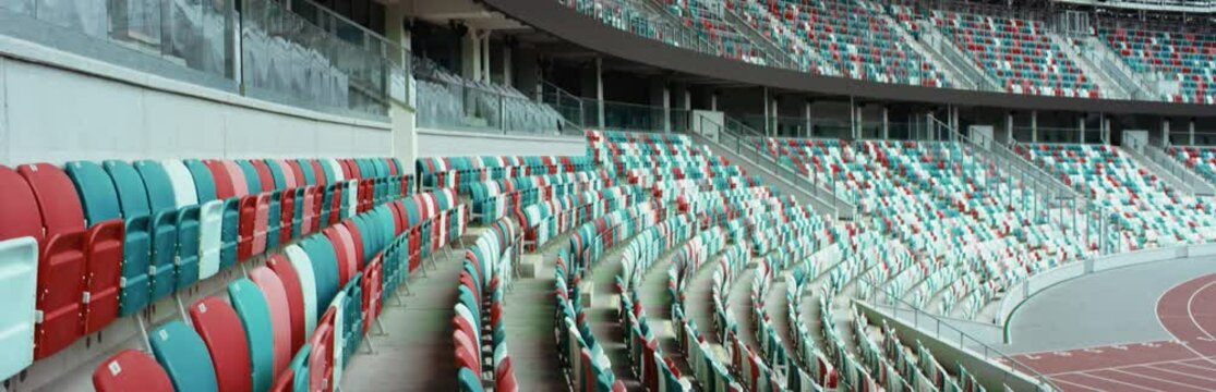 WIDE View of empty stadium seats before game or during Coronavirus COVID-19 pandemic. Shot on RED cinema camera