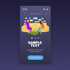 Fototapeta premium girls chatting during meeting women discussing daily news sitting on sofa chat bubble communication concept smartphone screen mobile app full length copy space vector illustration