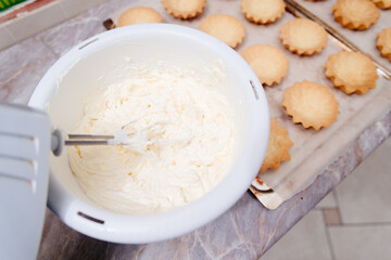 Butter cream for tart cakes. The process of making cream colored cream for tart tarts. Cream...