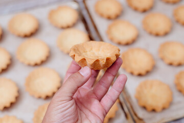 The process of making a tartlet cake. Tart cake. Cake basket. The process of filling cream cakes. Cream with food colors. Dye colored cream. Home kitchen. Homemade Tart Basket Cakes