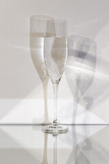 transparent glass with carbonated liquid on a white background and multiplied shadow	