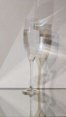 transparent glass with carbonated liquid on a white background and multiplied shadow	