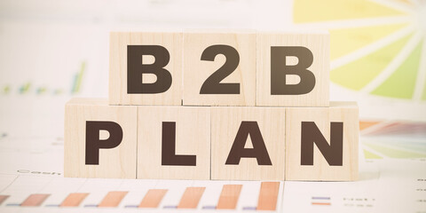 words b2b plan made with black letters on cubes on desk