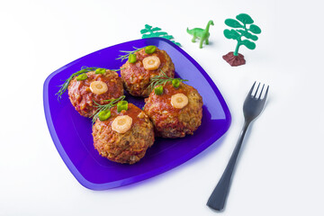 Child food. Funny food. Plate with buckwheat cutlets or meatballs in the form of funny faces decorated with greens. Children's or kids menu. Healthy eating. Сopy space for text