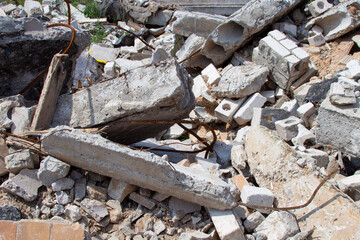 Pieces of concrete and brick debris in an open-air structure