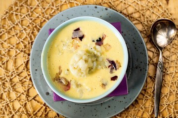 Cauliflower soup in bowl, closeup.