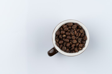 Ethiopia banco gotete coffee beans in a cup, specialty coffee, isolated on white background, copy space