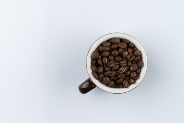 Ethiopia banco gotete coffee beans in a cup, specialty coffee, isolated on white background, copy space