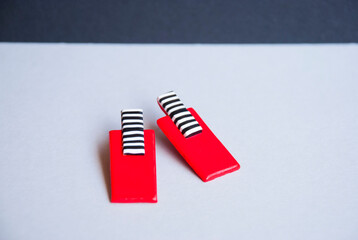 Trendy modern red rectangle earrings. Handmade jewelry design of polymer clay.