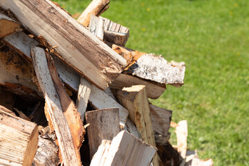 A pile of chopped birch firewood. Harvesting for the winter.