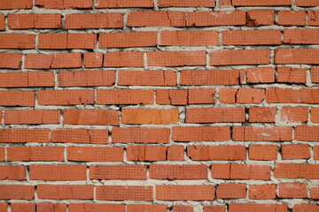 Old red brick wall in an abandoned building