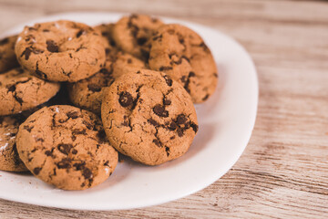 some chocolate cookies on a white plate