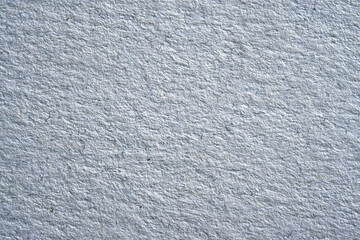 Abstract background and texture from a close-up of a rough thick paper, macro