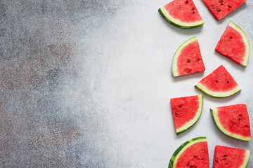 Slices of watermelon on the concrete background. Copy space. Top view. 