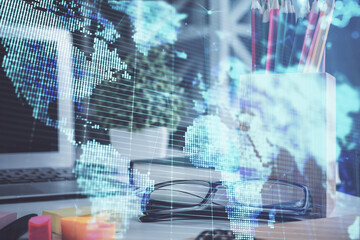 Business theme hologram with glasses on the table background. Concept of search. Double exposure.