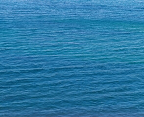 Small waves on the blue sea water. Nature background, travel vacation