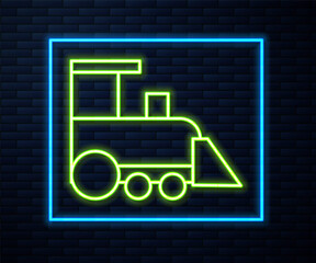Glowing neon line Toy train icon isolated on brick wall background. Vector.