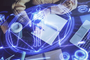Education theme hologram over woman's hands writing background. Concept of study. Double exposure